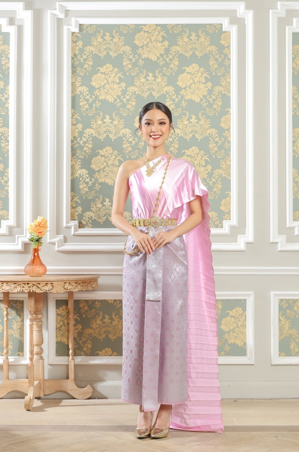 Photo of woman wearing a pink Thai traditional dress