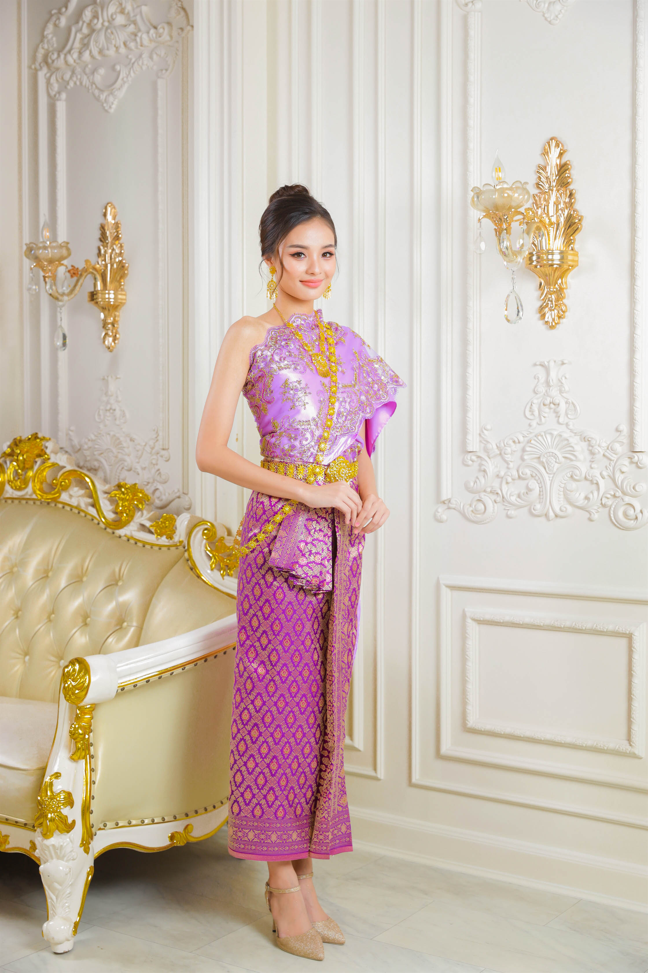 Purple Thai traditional dress worn by Thai woman