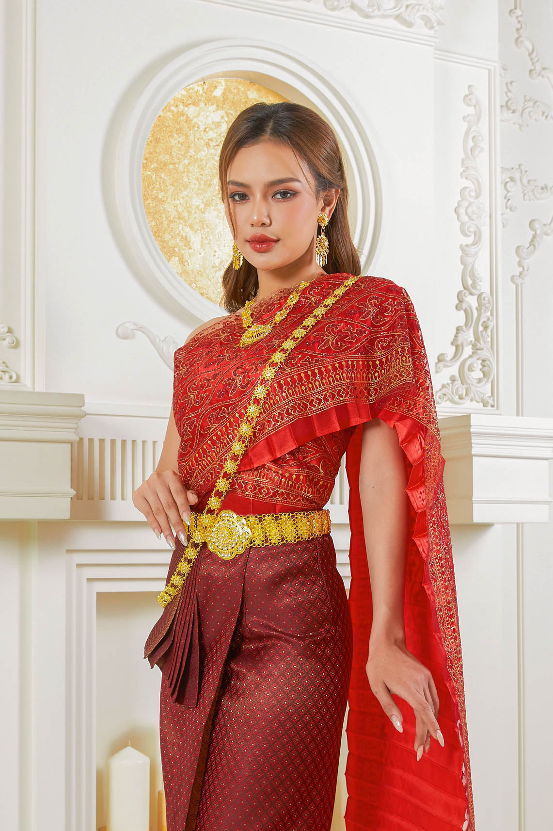 Traditional Thai costume in red and gold