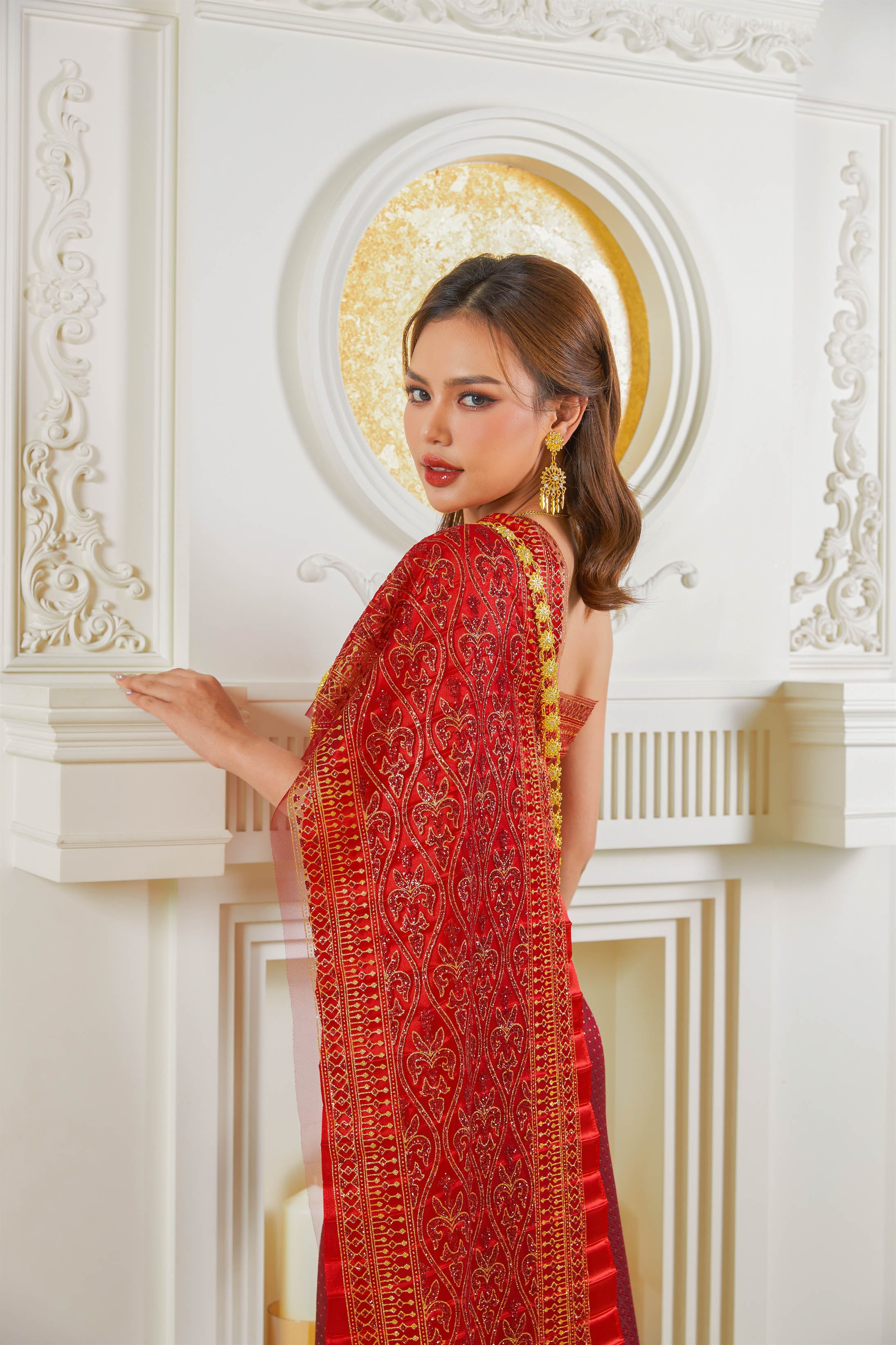 Thailand's national dress in red and gold